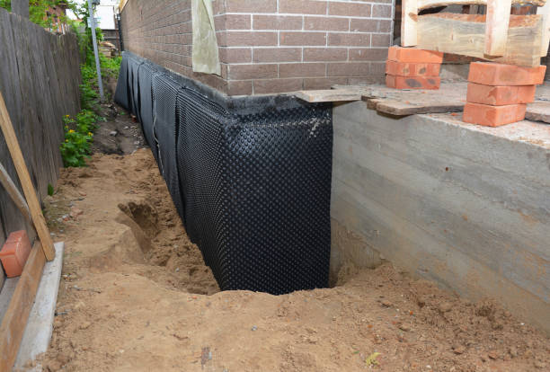 Happy homeowners after waterproofing job in Warrenton